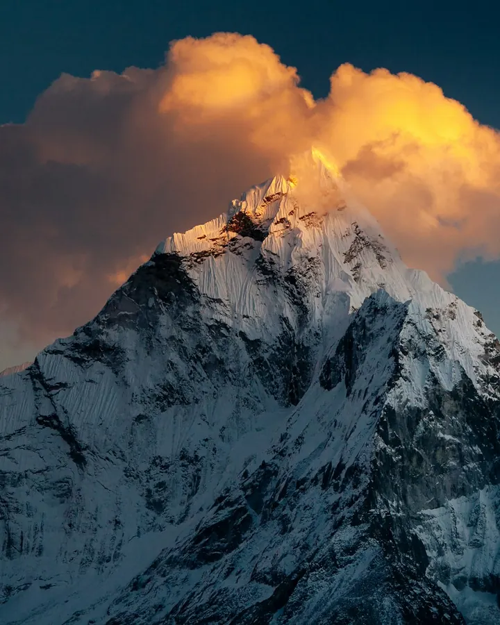 Hikers on a mountain ridge at sunrise